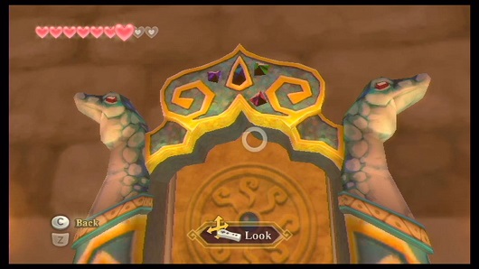 Strange door decorated with lizard carvings in the Earth Temple